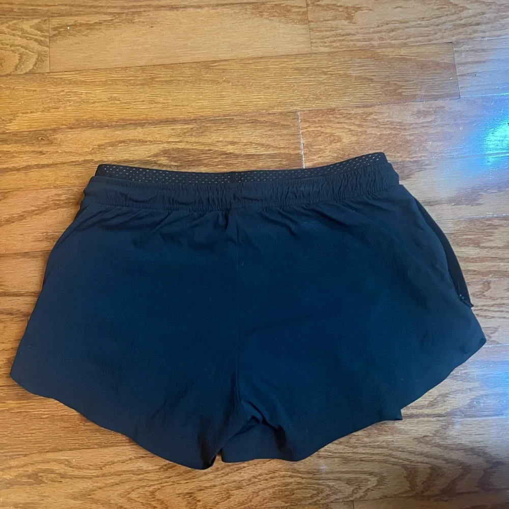 Athleta size 4 woman’s black 2 in 1 athletic shorts with drawstring - Picture 3 of 6